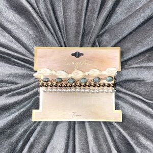 Gold charm set bracelets